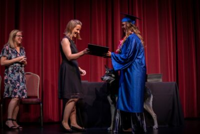 Graduate student receiving her diploma image