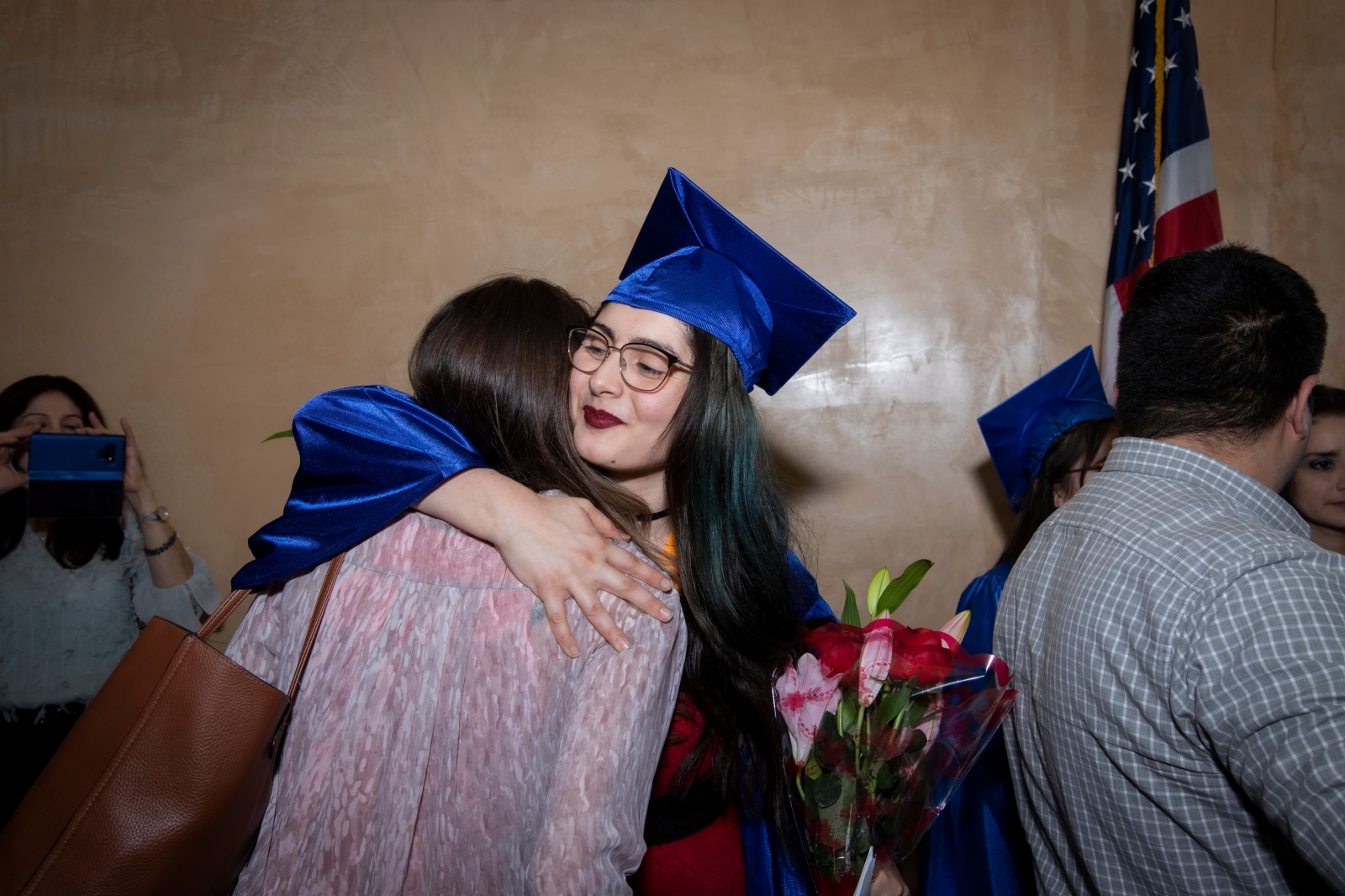 Graduate student hugging image