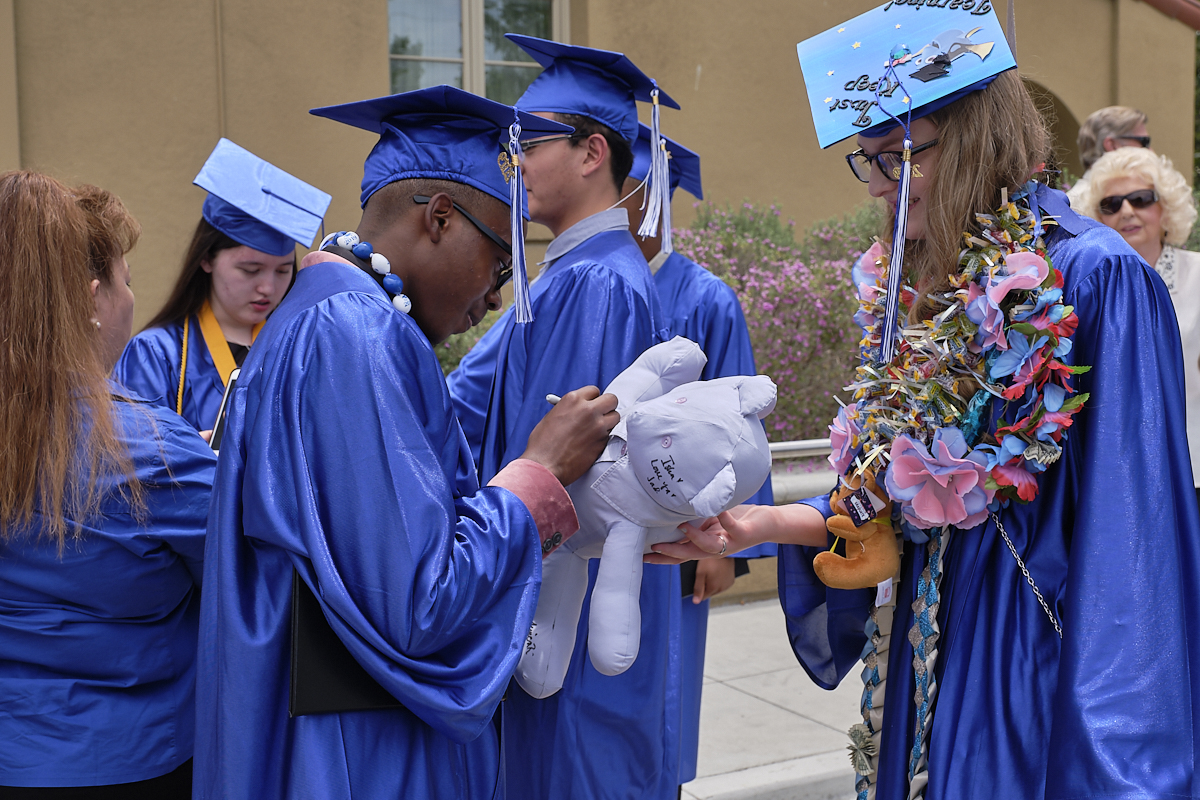 Graduate students exchanging presents image