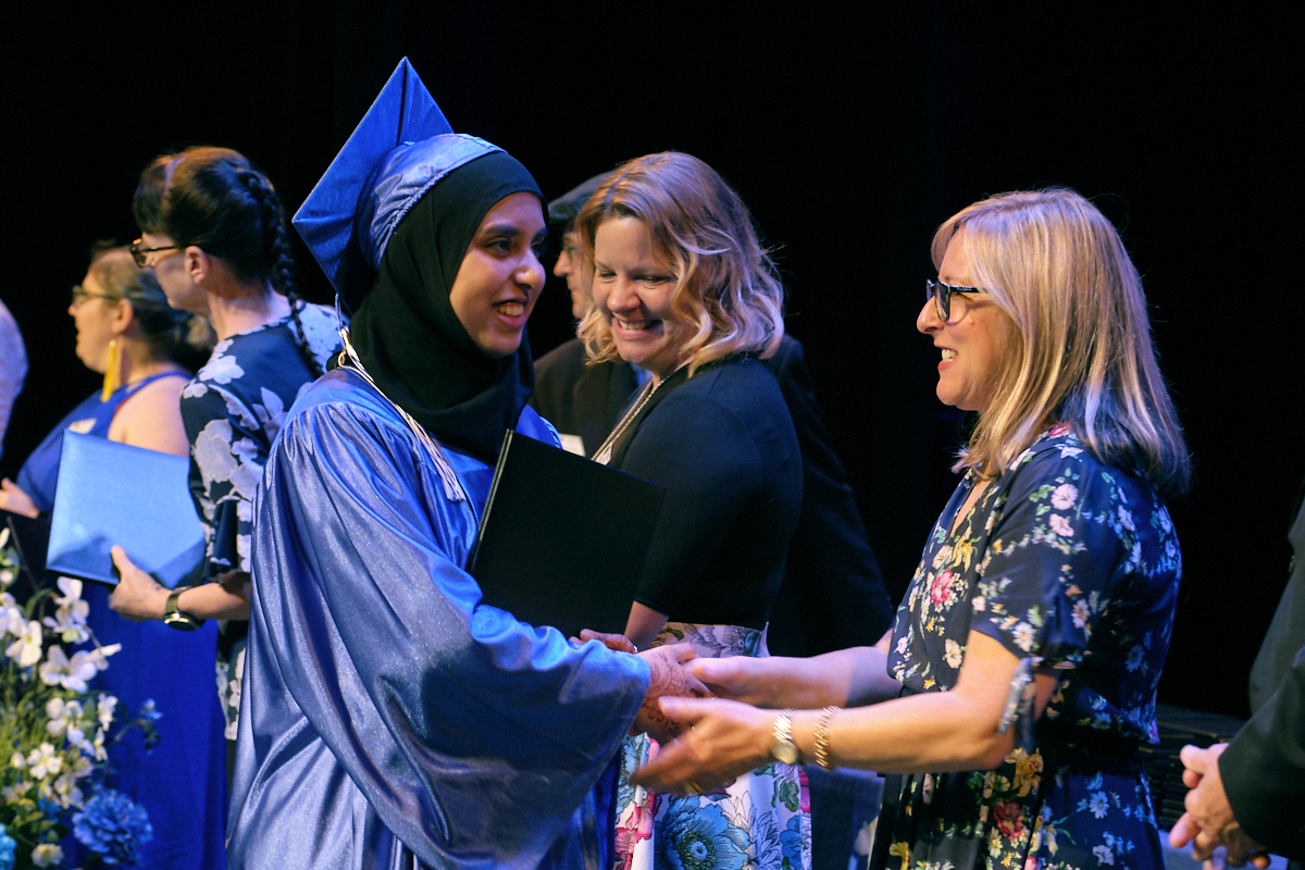 Graduate student receiving her diploma image