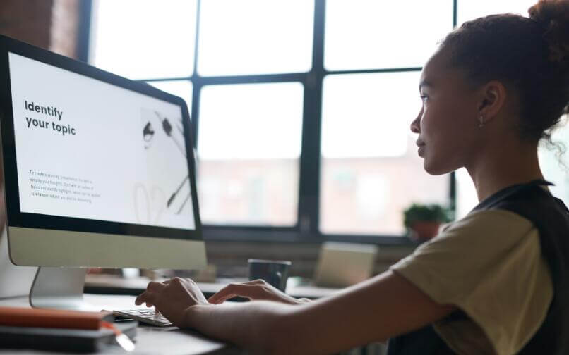 High School student using her computer.