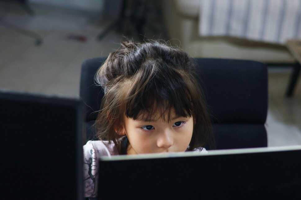 girl looking the computer... Getty Images