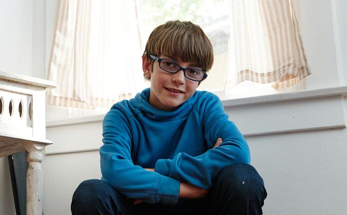 Student wearing a light blue hoodie